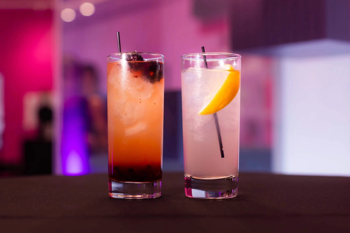 Two cocktails, one with raspberries and the other with lemon are served at the event in Museum of Illusions Las Vegas.